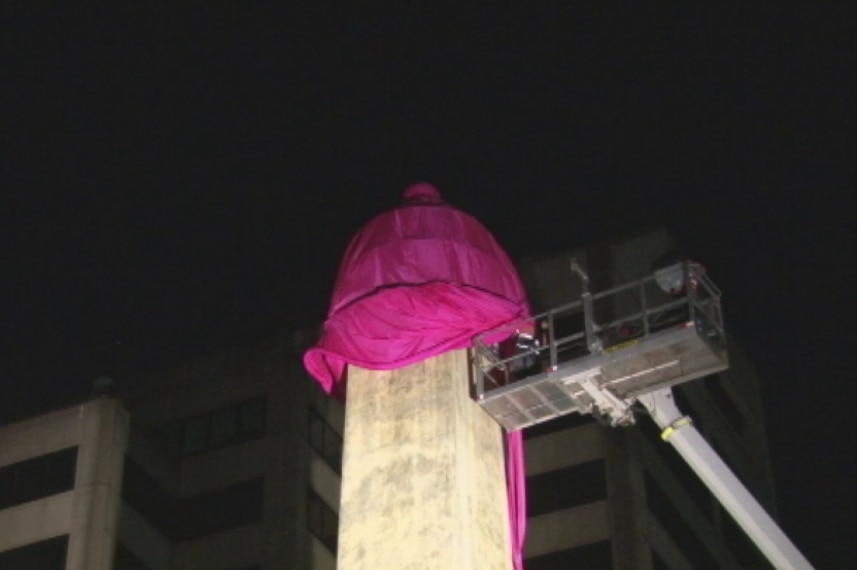 Giant pink condom goes onto obelisk