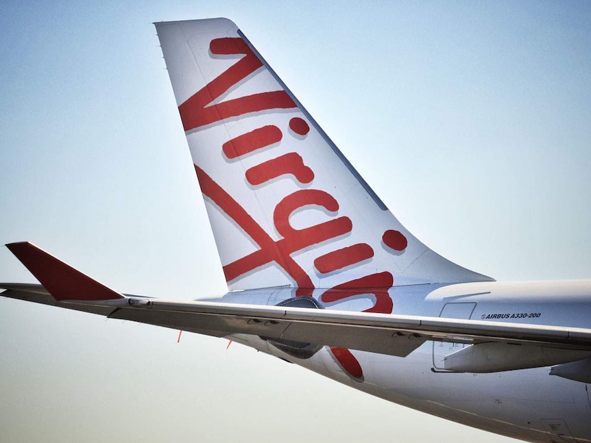 Close-up of tail of a Virgin Australia aircraft at Brisbane Airport.