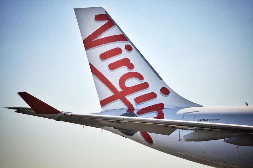 Close-up of tail of a Virgin Australia aircraft at Brisbane Airport.