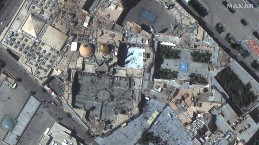 Satellite imagery shows crowds of people at the Shrine of Fatima Masumeh in Iran.