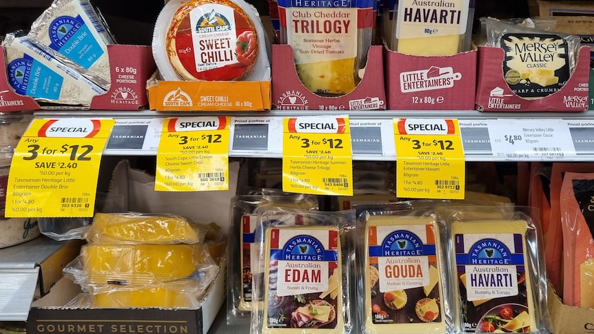 Row of Tasmanian cheeses sit on a supermarket shelf