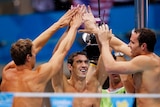 Michael Phelps, Matthew Grevers (L) and Brendan Hansen (R) celebrate the 4x100m medley relay win.