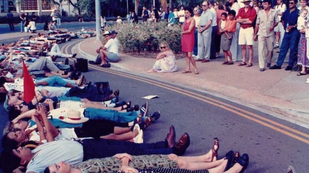 Darwin residents lie side-by-side in a city street in 1991 after news of the Santa Cruz massacre in Dili