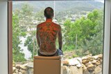 An artist  known as the human canvas is on show at Hobart's MONA.