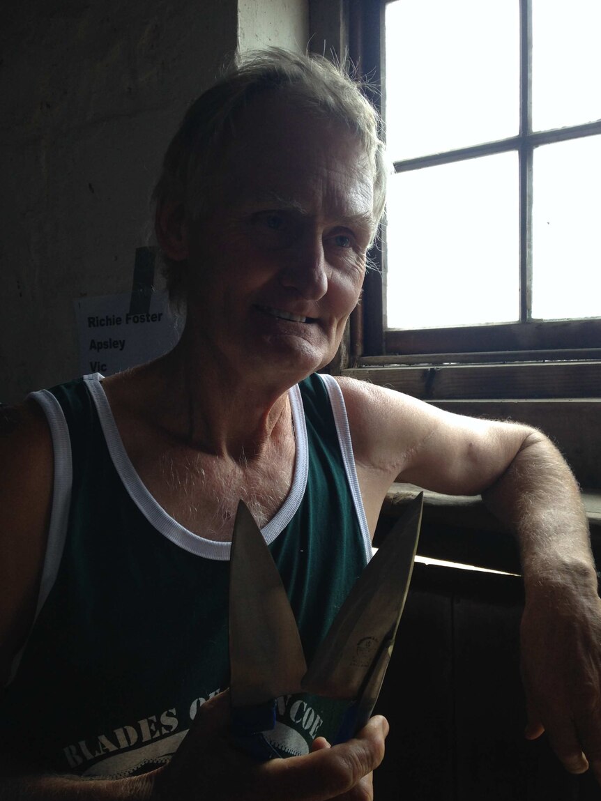Richie Foster holds a pair of shearing blades.