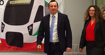 Mark McGowan in front of Ellenbrook train