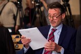 IAAF president Sebastian Coe at a press conference regarding a report into alleged corruption and doping