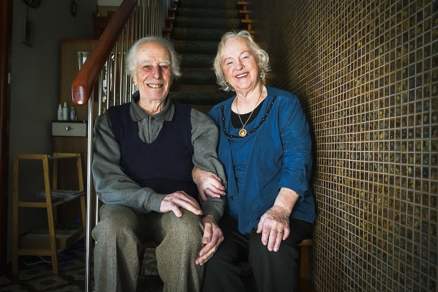 Peter and Nerina Callea sit together in their home