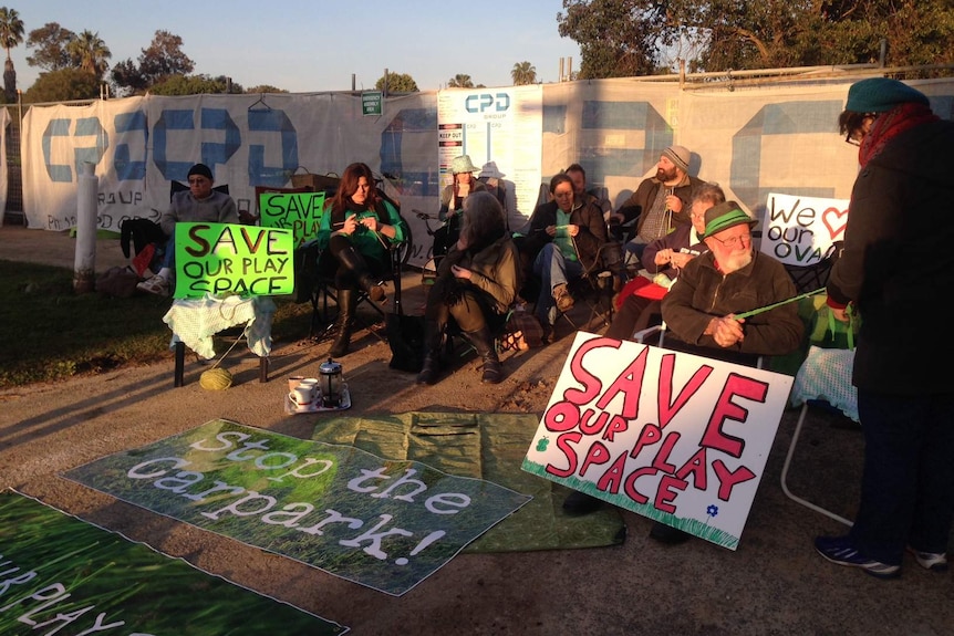 Bassendean Primary School parents blockade the car park site with a knit-in.