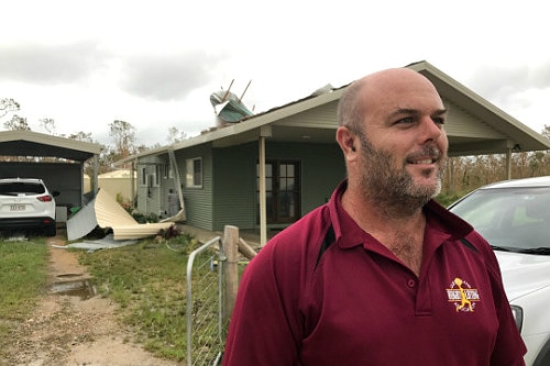 Resident Nathan Sainsbury stands outside his home in Proserpine