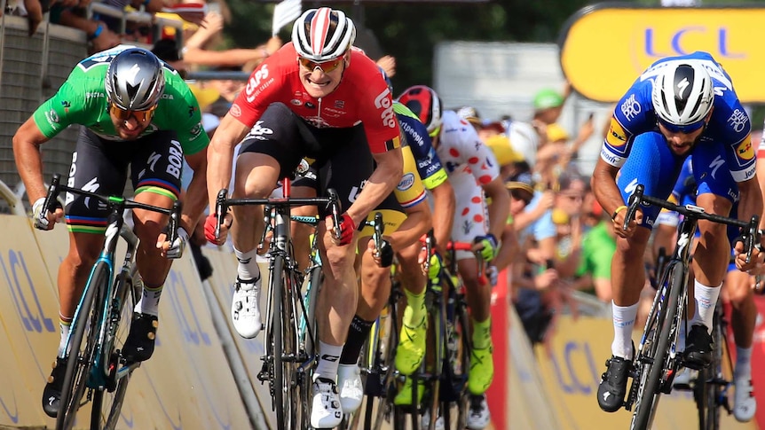 Fernando Gaviria (R), crosses the finish line to win the fourth stage of the 2018 Tour de France.