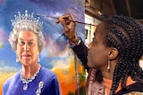 A woman leans in close to a portrait of Queen Elizabeth II holding a paintbrush with blue paint on it.