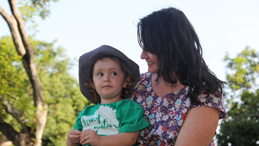 A close-up of Liz Trevaskis looking at her toddler Archie.