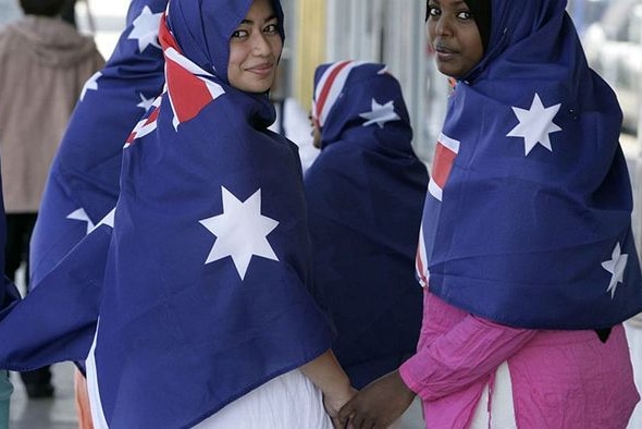 Muslim women wear the flag as hijab