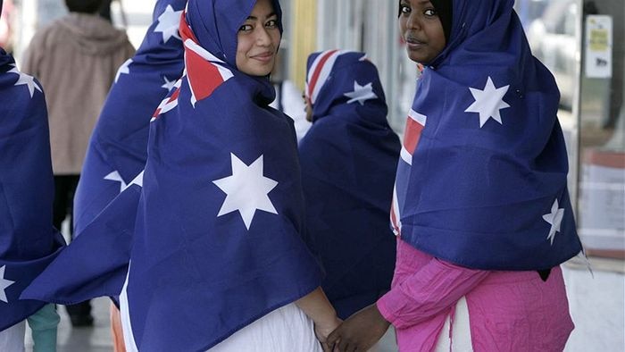 Muslim women wear the Australian flag as hijab.