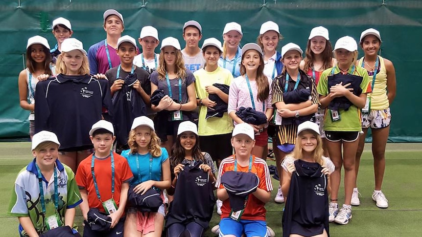 A group photo of the Top End ball boys and girls after their were handed their uniforms for the Davis Cup in Darwin