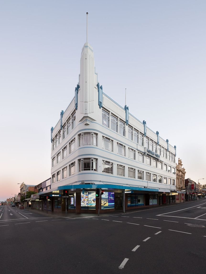 an art deco building, white with blue trim