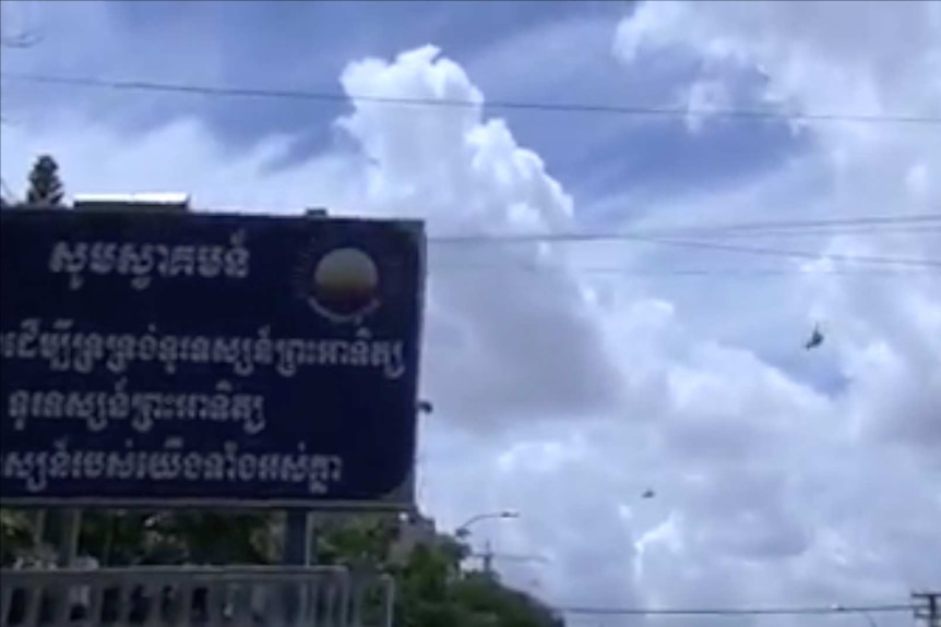 Military helicopters circled in the sky above the CNRP headquarters