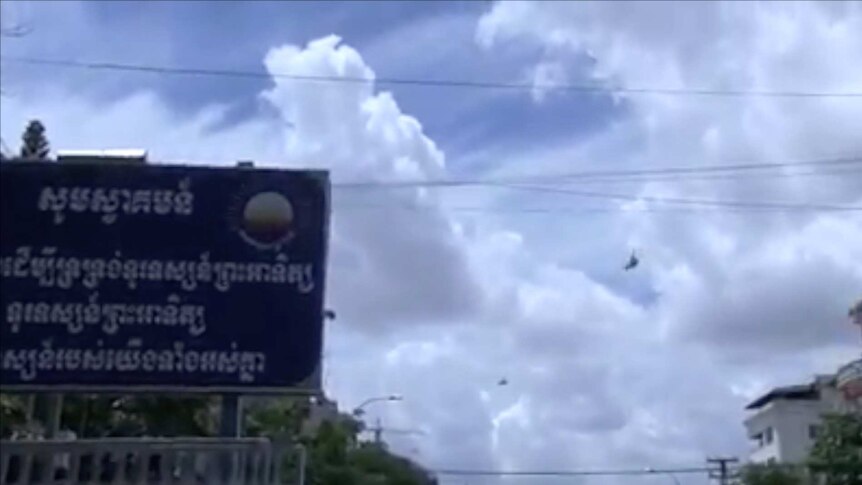 Military helicopters circled in the sky above the CNRP headquarters