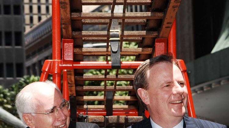 John Howard and Peter Costello sit in a historic fire engine
