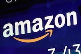 A logo for Amazon is displayed on a screen at the Nasdaq MarketSite, July 27, 2018.