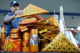 A Filipino policeman displays confiscated firecrackers