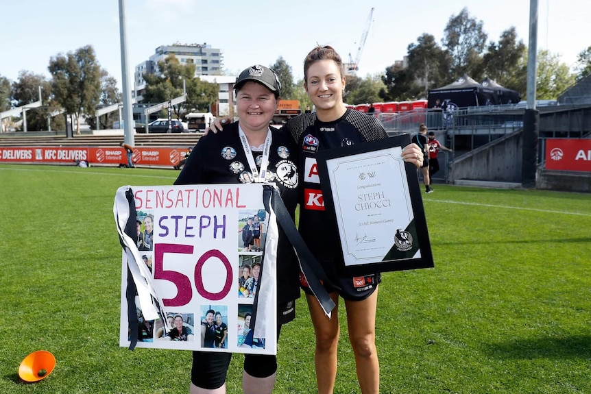 Fearn Harrison holds a poster that says sensational steph and Stephanie Chiocci holds a certificate.