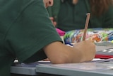 A student works in a classroom