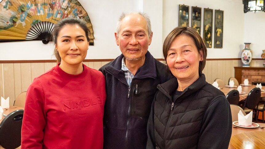 Cindy, Allan and Patricia Ho inside the dining room of their family's Chinese restaurant.