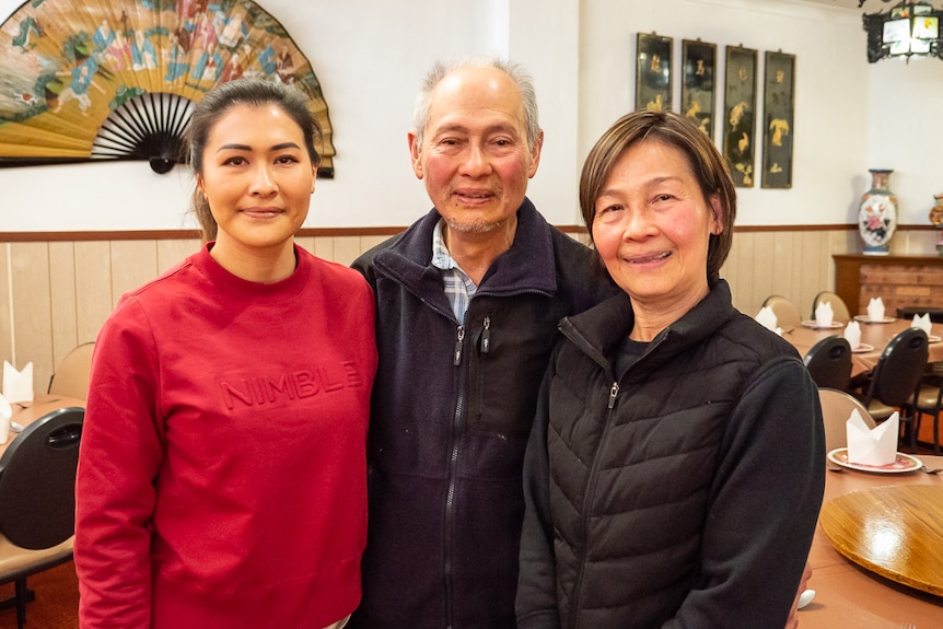 Cindy, Allan and Patricia Ho inside the dining room of their family's Chinese restaurant.