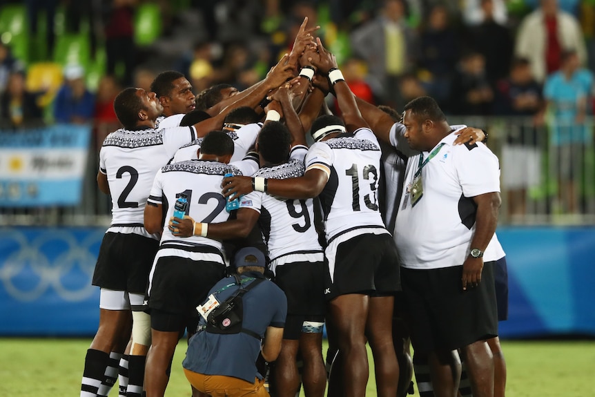 The Fiji sevens team celebrates its gold medal win