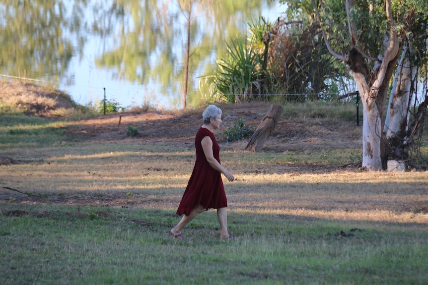 A woman walking in a garden