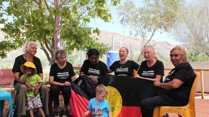 Grandmothers Against Removals members sit together in Alice Springs.