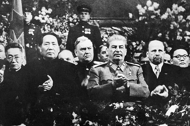 Mao Zedong and Joseph Stalin stand among the crowd. 