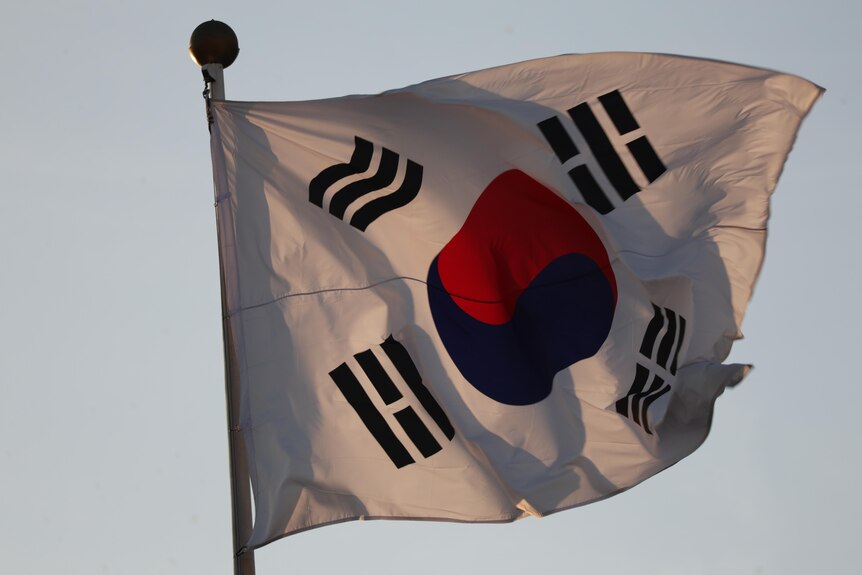 A South Korean flag on a pole moves in the wind