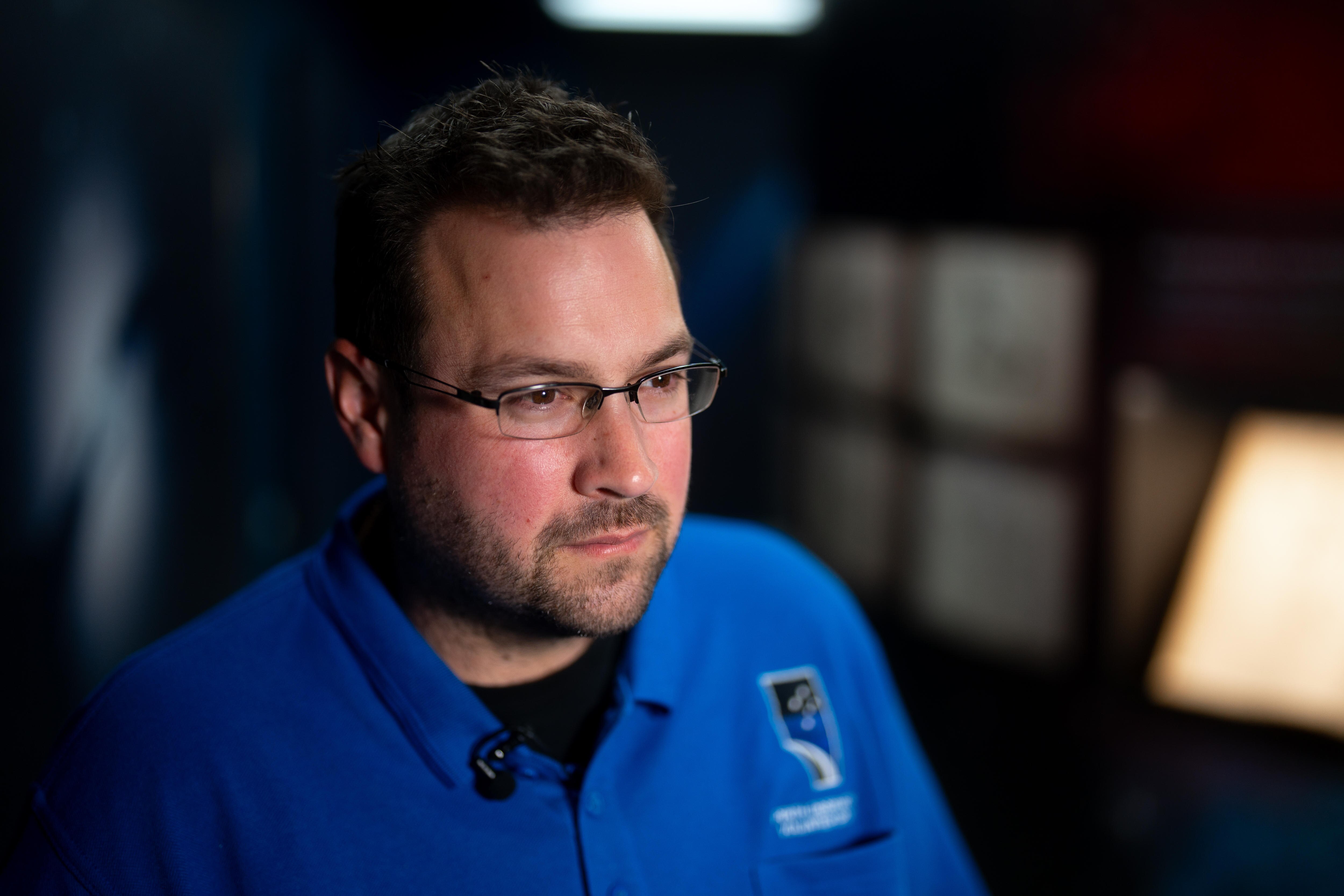 Matt Woods looks intently at something we can't see. 