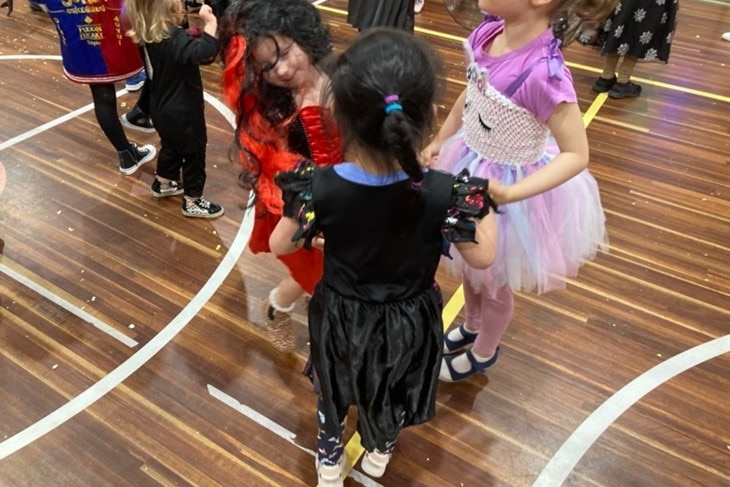 Sonya dancing with her kinder friends at the party.