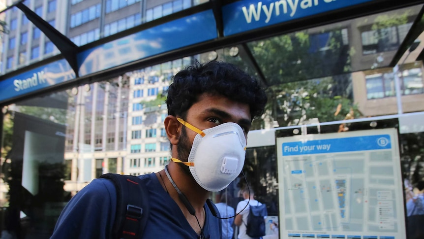 A Sydney man wearing a protective mask.
