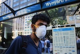 A Sydney man wearing a protective mask.