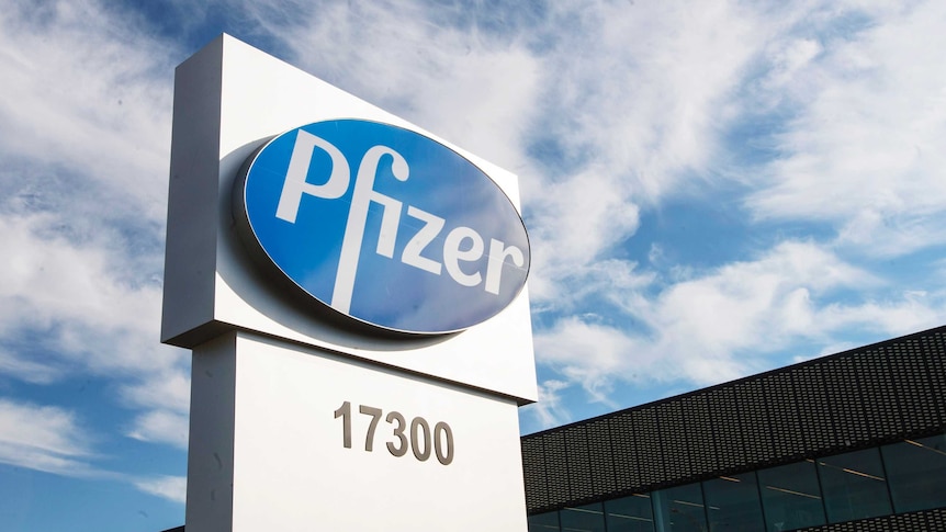 A sign with the Pfizer logo stands outside the corporate headquarters building.