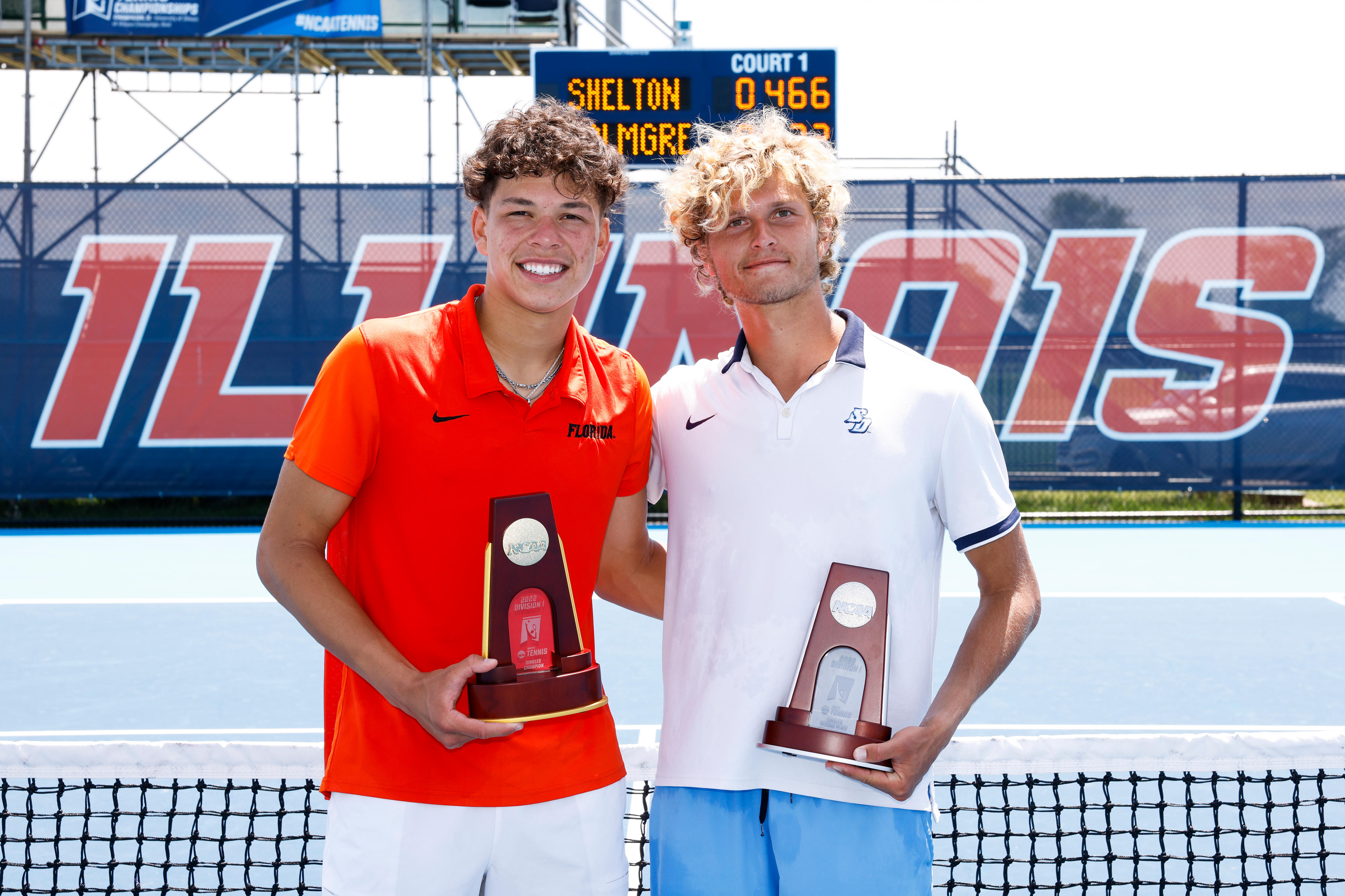 Ben Shelton and August Holmgren at a 2022 NCAA trophy presentation.