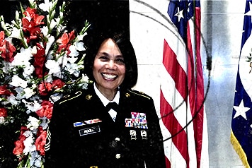 Woman smiling at the camera in formal officer dress.