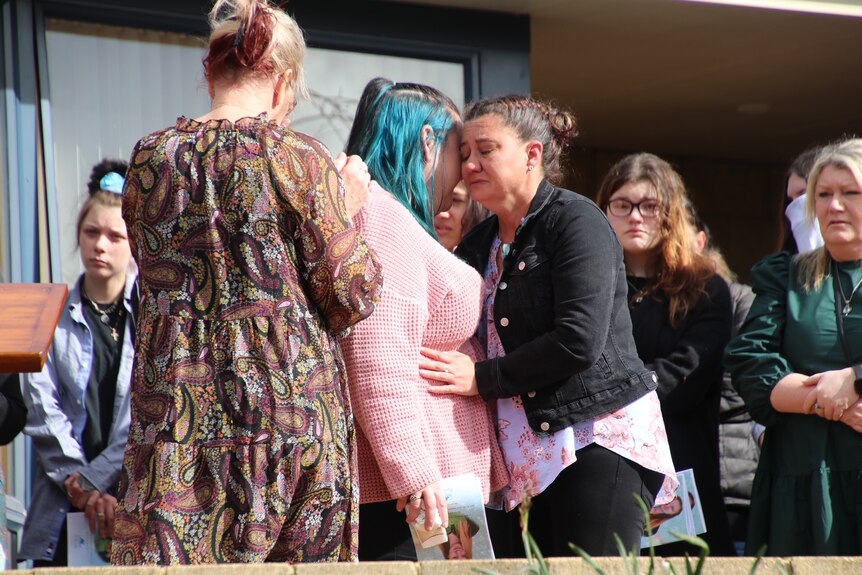 Mourners with Bobbi-Lee Ketchell at funeral for Shyanne-Lee Tatnell.