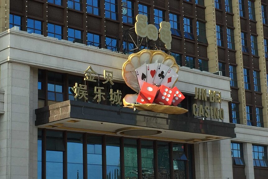 A gold sign marks the entrance to the Jin Bei Hotel and Casino in Cambodia.