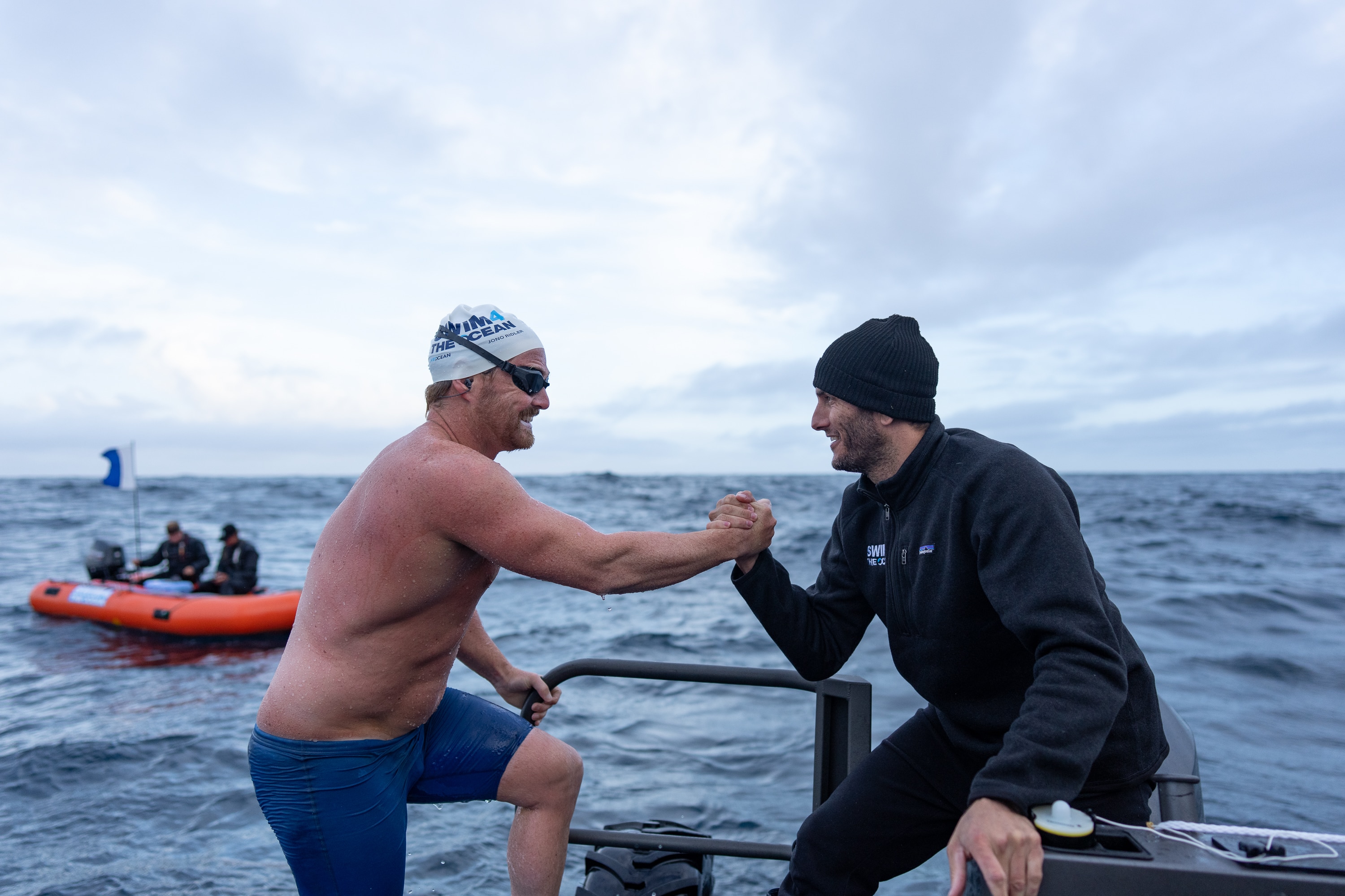 Jono Ridler shakes hands with Blair Tuke