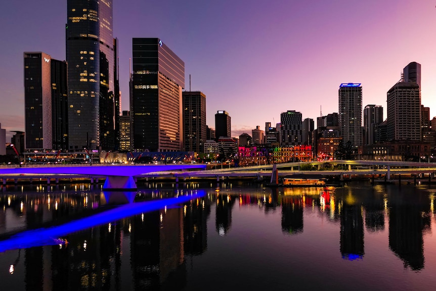 A bridge in Brisbane glows purple.