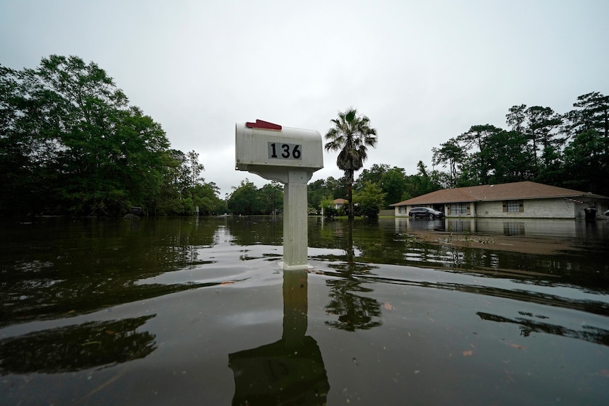 A flooded neighborhood is seen after Tropical Storm Claudette passed through