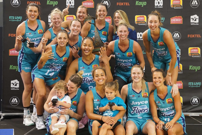 The Southside Flyers celebrate their WNBL grand final win over the Fire in Townsville.