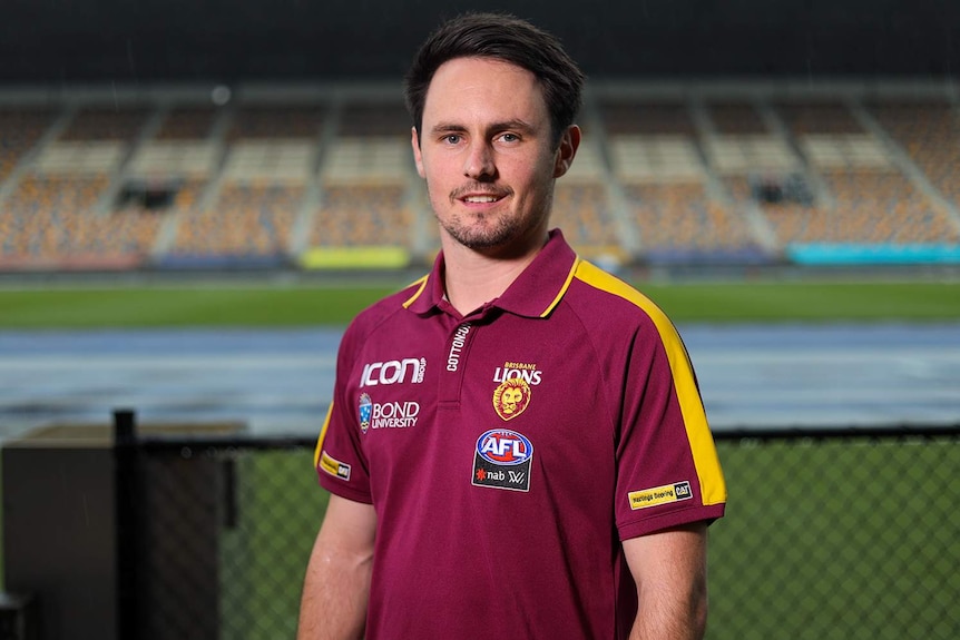 Brisbane Lions coach Matt Green smiles as he stands at the AFL stadium at Woolloongabba in Brisbane.