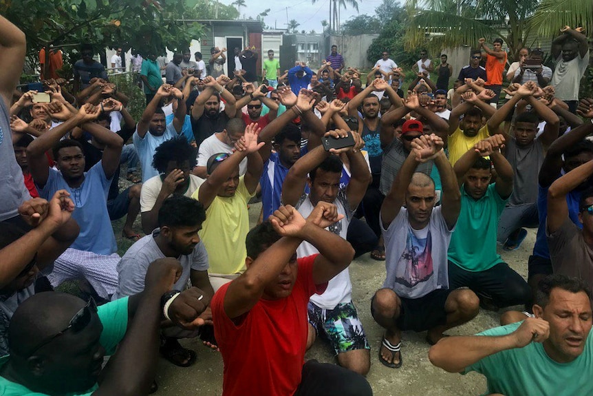 Residents of Manus Island detention centre squatting with hands above their heads hours before centre due to close